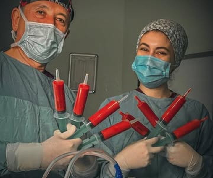 Two members of the StePlus surgical team in the operating room